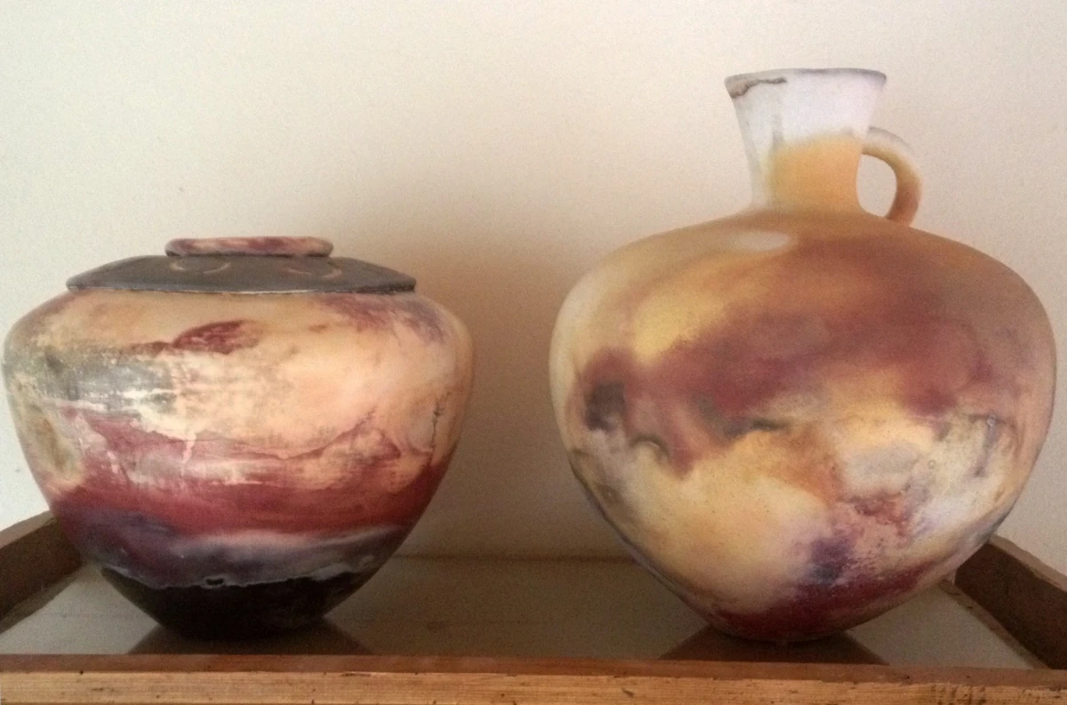 Large unglazed pots, white clay, pit-fired on a beach in northern California with cow dung fuel and seaweed