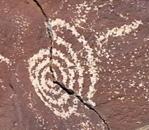 A spiral, often a symbol of transformation, in a petroglyph in New Mexico
